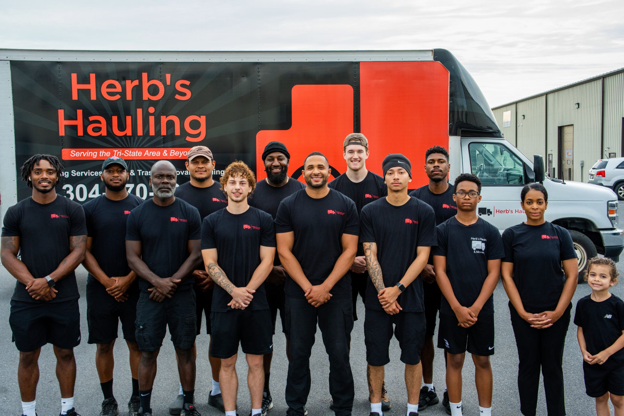 The Herb's Hauling team in front of the company truck