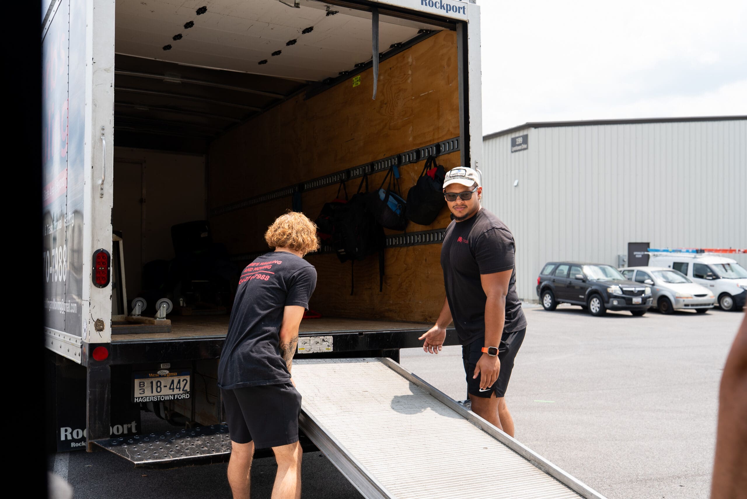 Herb's Hauling crew loading boxes and furniture