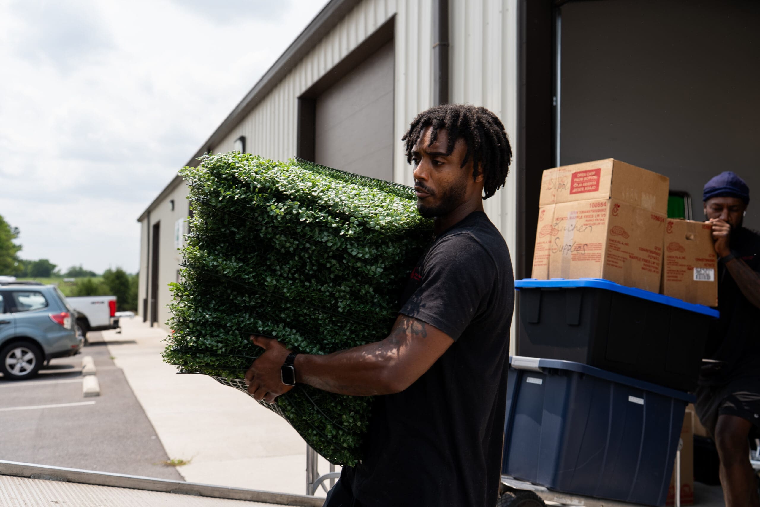 Herb's Hauling crew carrying office furniture