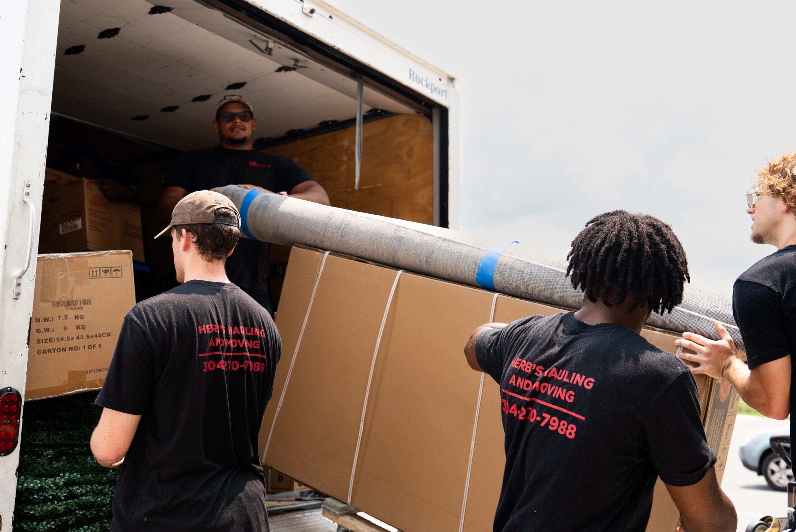 Herb's Hauling crew loading the moving truck